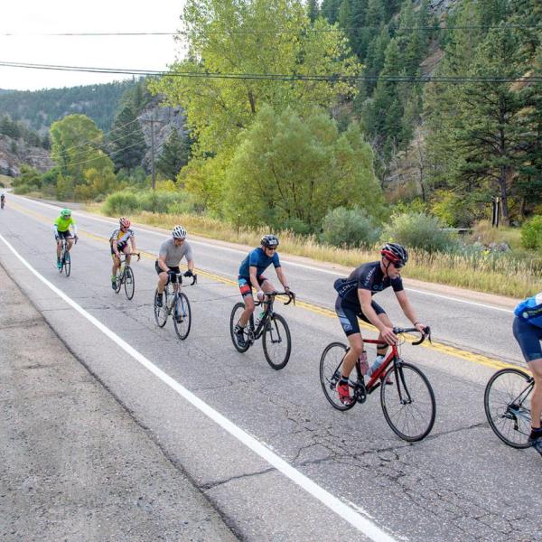 Cyclists riding on a road for Buffalo Bicycle Classic
