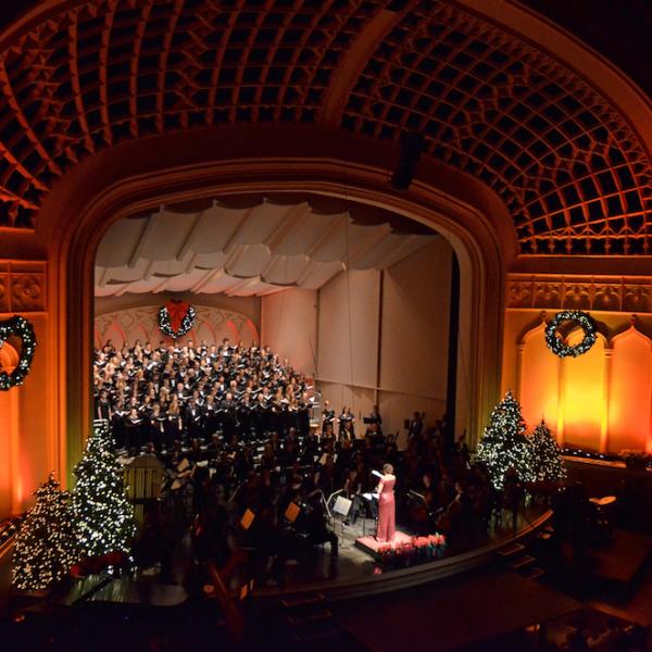 The holiday concert performers are on Macky's stage amidst holiday decorations
