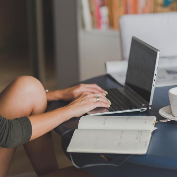 person typing on laptop