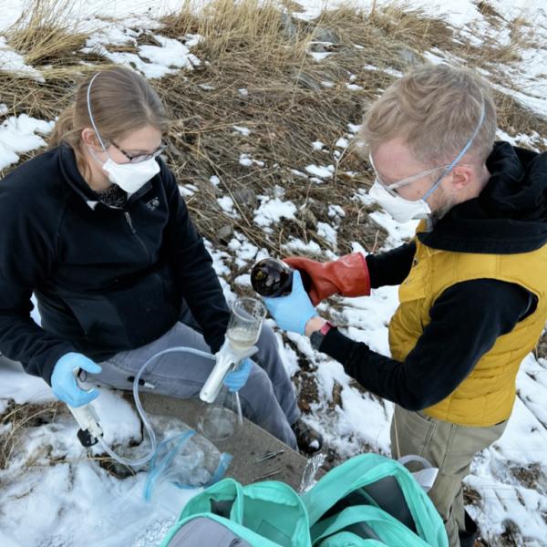Researchers conduct water sampling.
