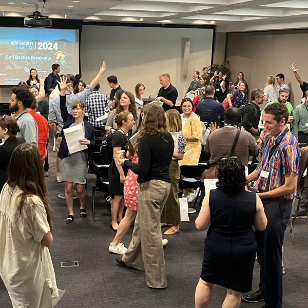 new faculty interacting at an orientation