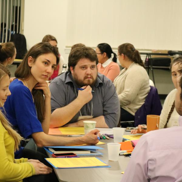Adam Lauver and others seated at a table