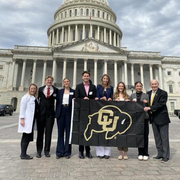 Chancellor Philip DiStefano, Professor Stefanie Johnson and student leaders in front of the capitol building