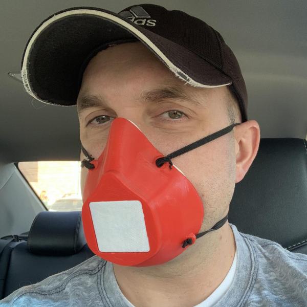Nick Schuster wearing a mask he printed