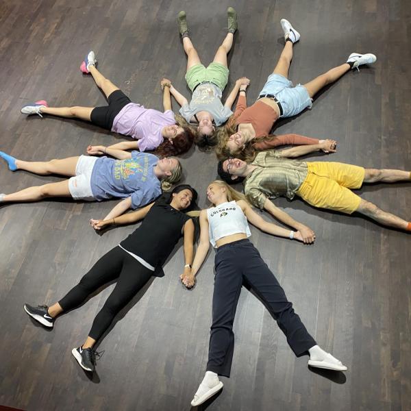 People laying in a circle