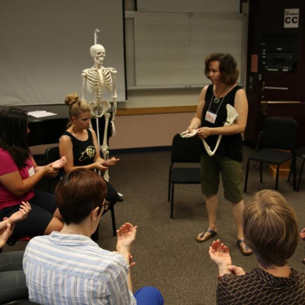 Music students practice the Alexander Technique with instructor