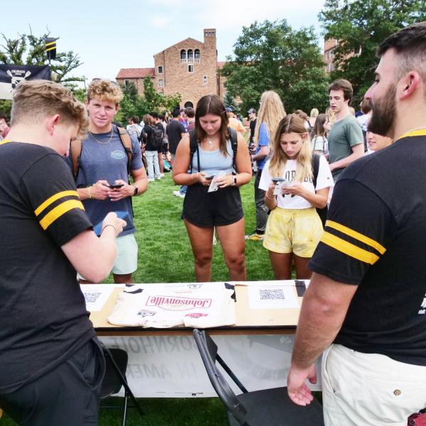 Students visit a booth at the 2022 Be Involved Fair