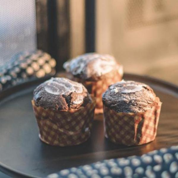 person baking muffins in a microwave