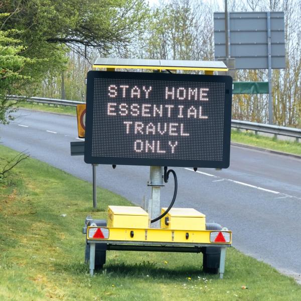 A sign that says stay home