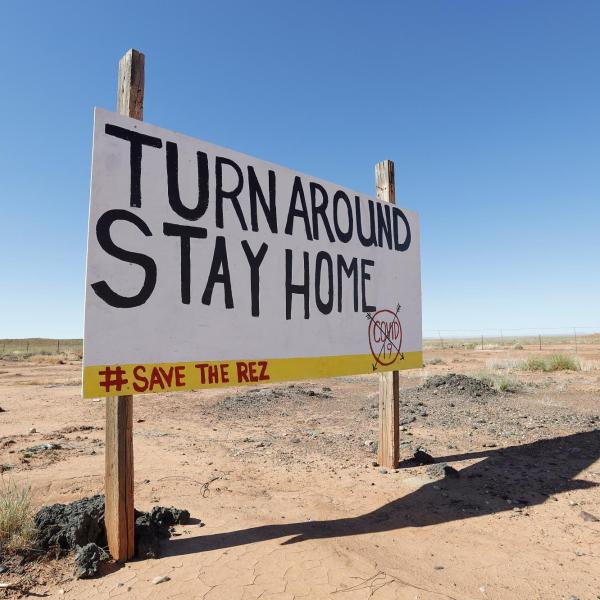 Navajo Nation sign that reads 'Turn around. Stay home'