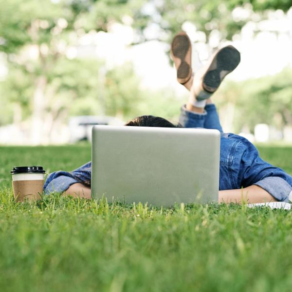 a student studying behind a laptop