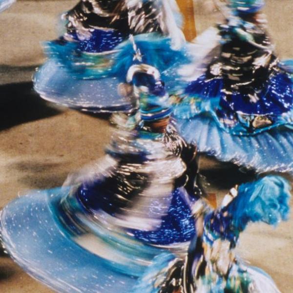 A stock image of people dancing in a parade