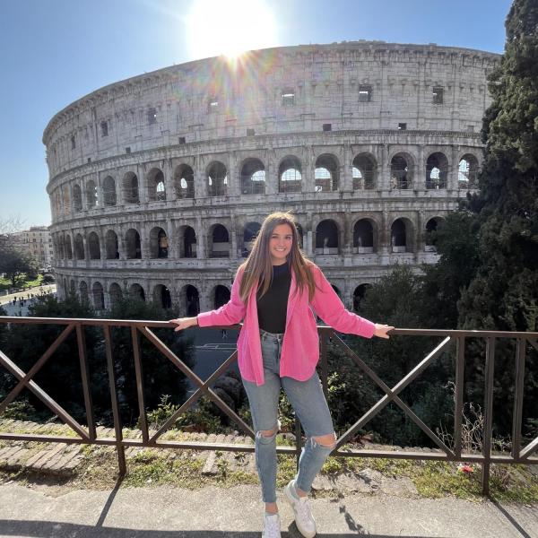 Student in front of the Colosseum in Rome, Italy