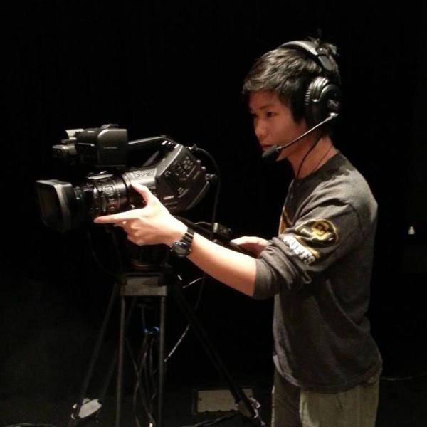 CU Boulder student Jackson Xia films for his job at CU Presents