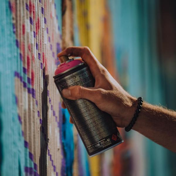 A person using a spray paint can