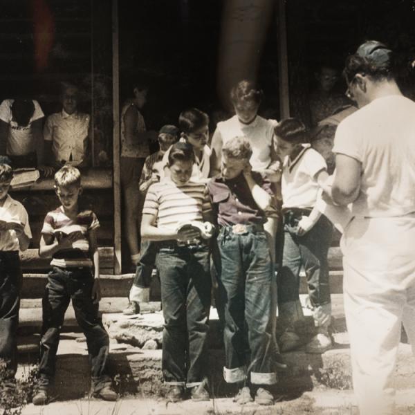 A photograph showing young Jewish children studying