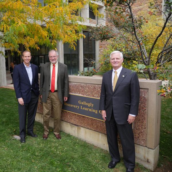 Jim Gallogly, CU Engineering School alumnus, CEO of LyondellBasell Industries and member of the CU Engineering Advisory Council, right, is photographed with CU Engineering Dean Rob Davis, center, and Mike Wirth, a Chevron corp. VP and chair of the CU Engineering Advisory Council after unveiling a temporary sign showing the new name for the Discovery Learning Center.
