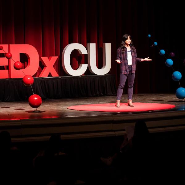 TEDxCU speaker on stage