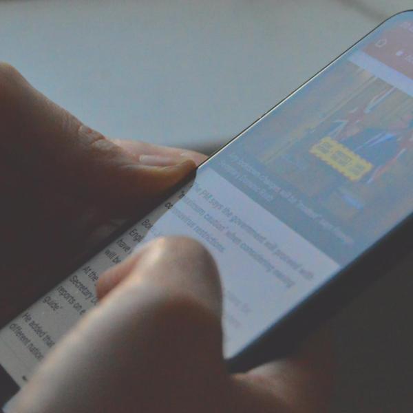 Stock image of a person holding a phone