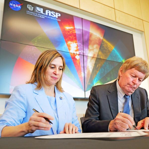 Goddard Space Center Director Makenzie Lystrup and LASP Director Dan Baker signing the collaborative Space Act Agreement