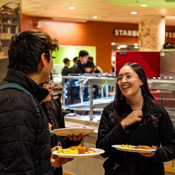 Two people enjoy Late Night Breakfast event