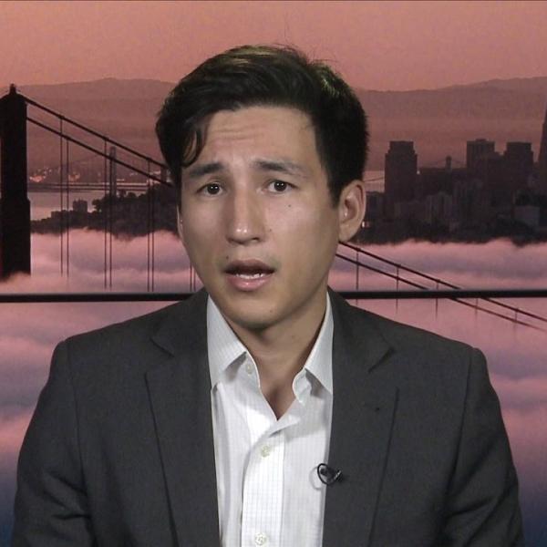 Lee Fang talks to a reporter