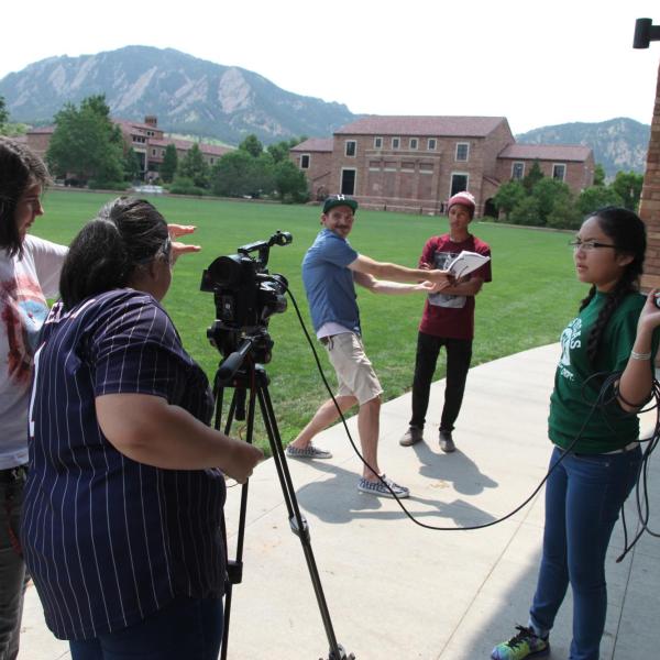 Students filming something on campus