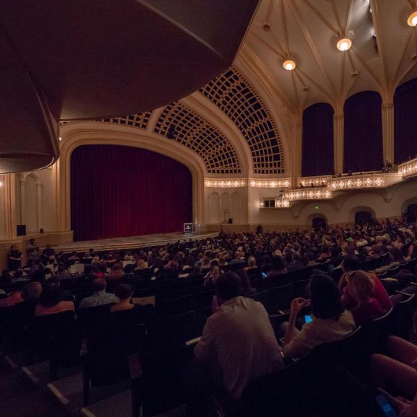 Audience members wait for speaker to take the stage in Macky Auditorium