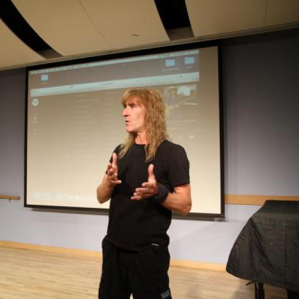 Mike Barnett talks to a student