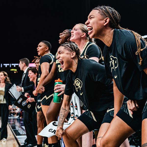 Members of the 2023 Buff Women’s Basketball Team cheer from the sideline
