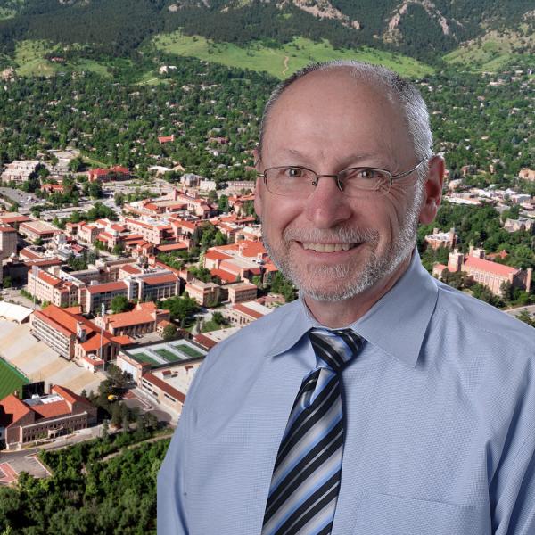 Provost Moore against a background of the university