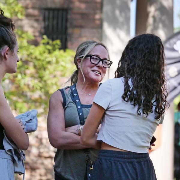 A family hugs during move-in 2022