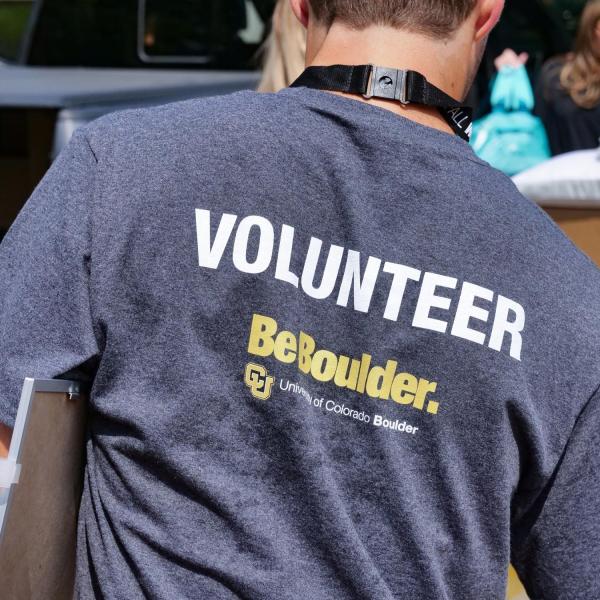 An employee volunteering during move-in
