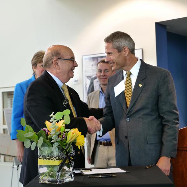 CU Boulder Chancellor Philip DiStefano and Lockheed Martin CTO Keoki Jackson shake hands