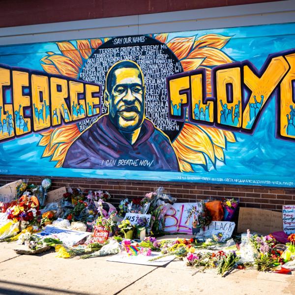 A mural at a memorial site for George Floyd. Photo by munshots on Unsplash