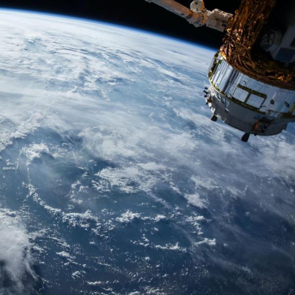 A photo of a satellite in orbit above Earth (Photo credit: NASA)
