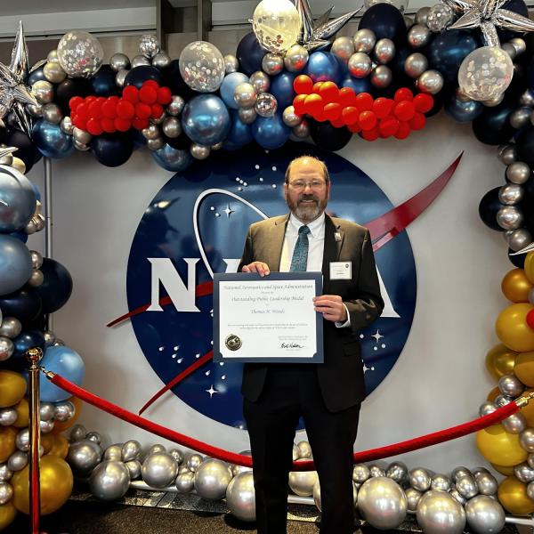 Tom Woods receiving NASA award