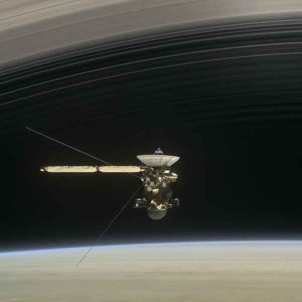 Artist's rendering of Cassini flying below Saturn's rings.
