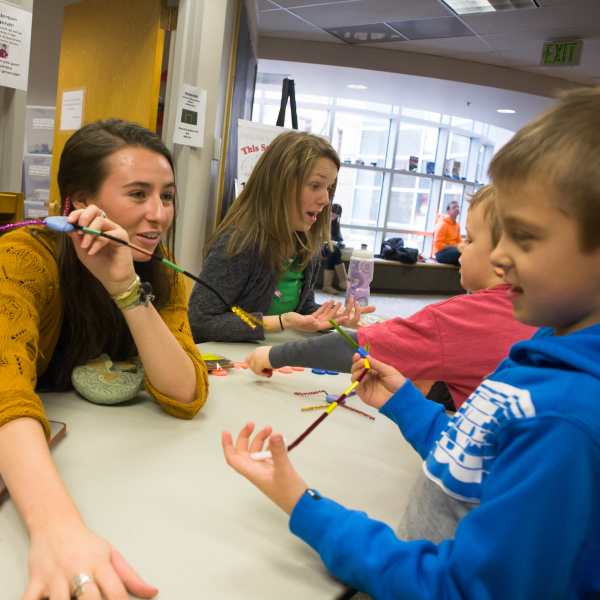 Students affiliated with CU Boulder's Intermountain Neuroimaging Consortium teach elementary school students about the brain