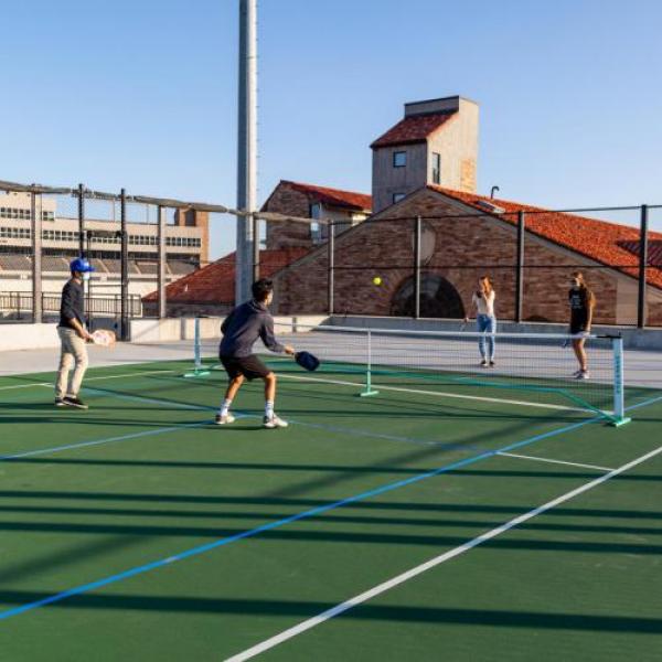 Students playing tennis.