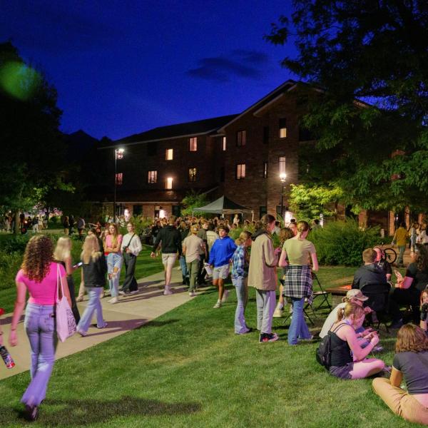 students on campus at night