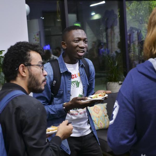 community members chatting at a New Venture Challenge event