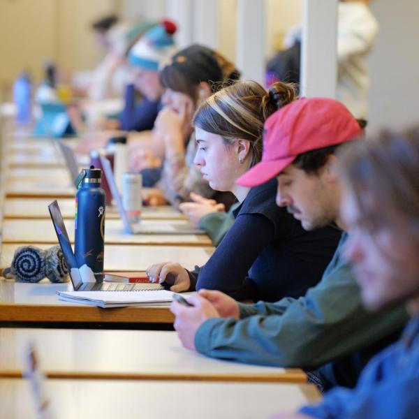 Students studying and working on laptops in Norlin Library