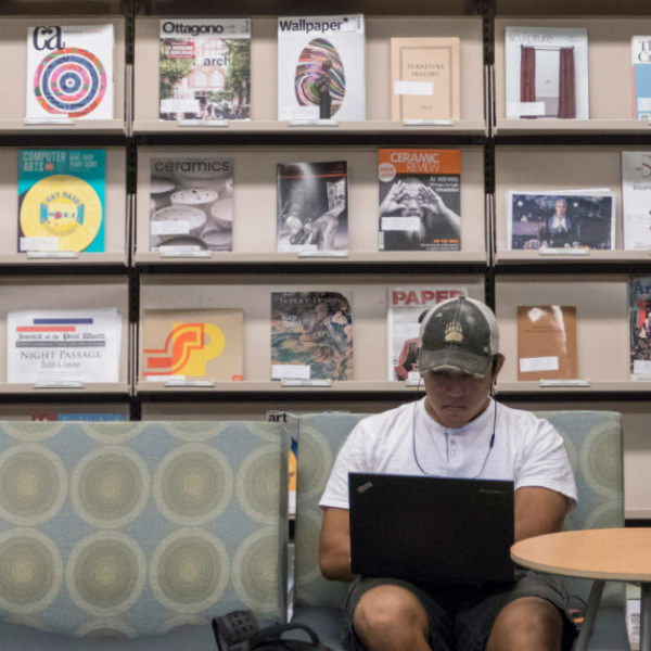 Student working on laptop in Norlin Library