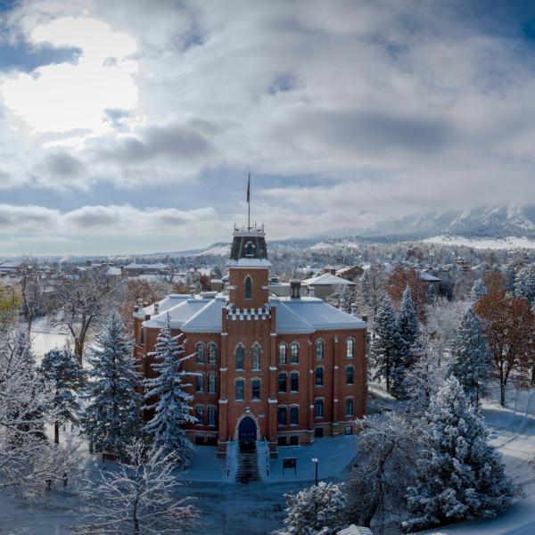 Old Main and a snowy campus