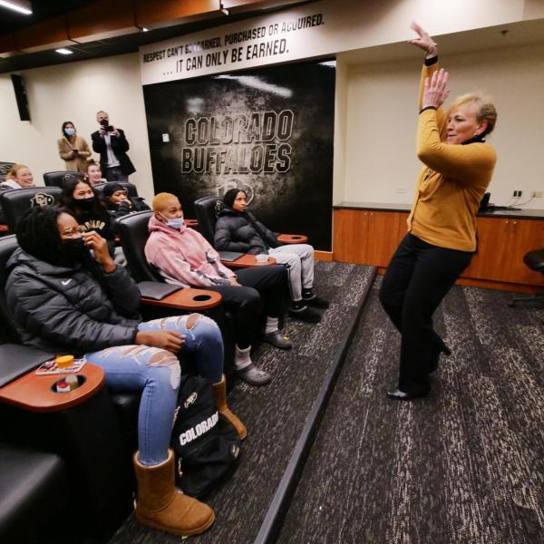 Angie Paccione speaks to members of the women’s basketball team during her visit