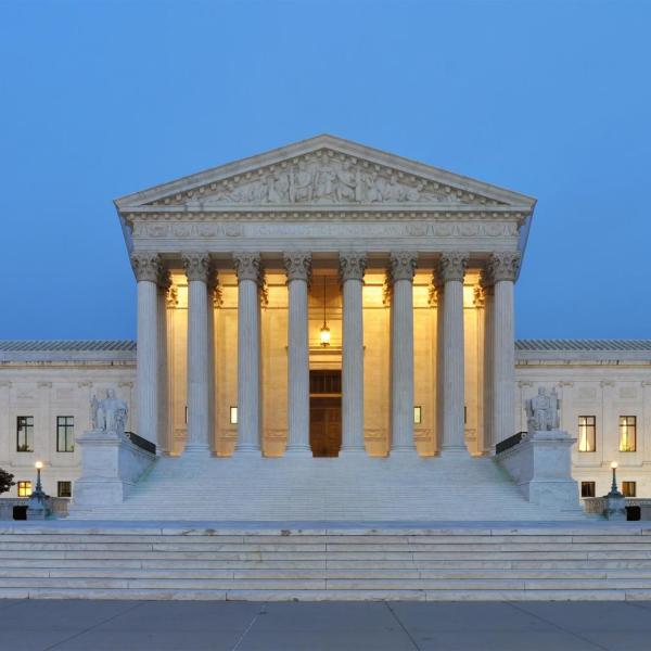 The United States Supreme Court building at dusk.