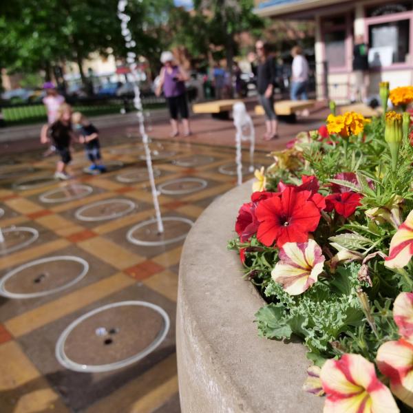 children play in fountain on Pearl Street