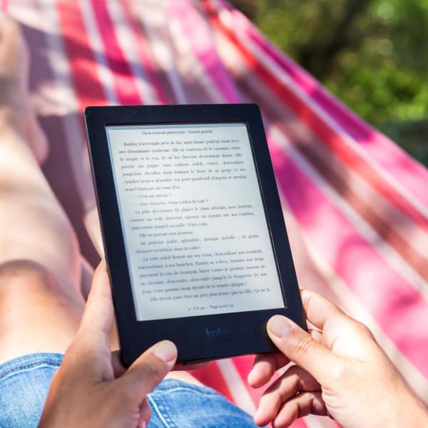 A person reading a book on an e-reader