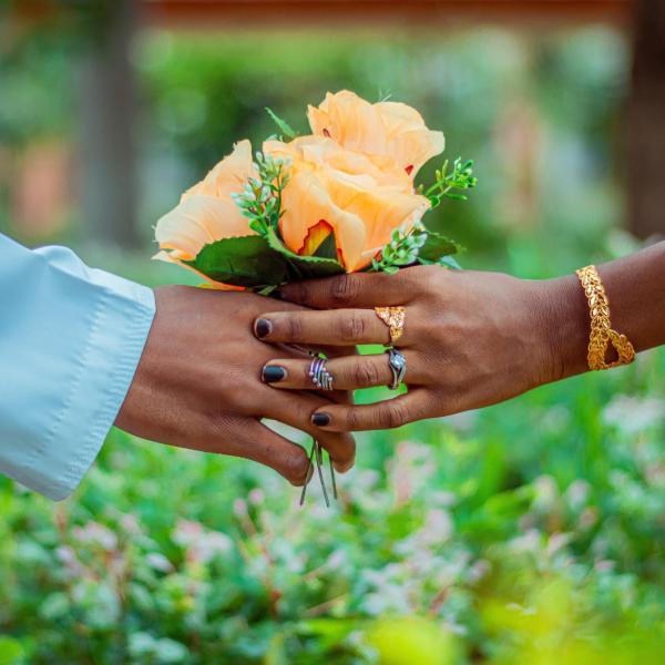 Two people holding hands